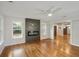 Open-concept living room with hardwood floors and a modern fireplace feature at 2855 Briarlake Ne Rd, Atlanta, GA 30345