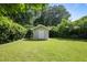 Backyard shed surrounded by lush greenery, offering additional storage in a well-maintained outdoor space at 2855 Briarlake Ne Rd, Atlanta, GA 30345