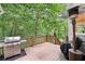Enjoy outdoor dining on this expansive back deck featuring a stainless steel grill and lush wooded views at 1285 Willow Park Way, Cumming, GA 30041