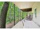 Spacious back porch perfect for entertaining, featuring a table, chairs, and serene wooded views at 1285 Willow Park Way, Cumming, GA 30041