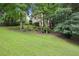 Expansive, well-maintained back yard surrounded by mature trees, offering privacy and tranquility at 1285 Willow Park Way, Cumming, GA 30041