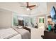 This spacious main bedroom features a tray ceiling, large windows and seating at 1285 Willow Park Way, Cumming, GA 30041