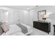 Cozy bedroom with a dark wood dresser, and neutral decor at 4660 Rosarian Drive, Cumming, GA 30040