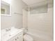 Clean bathroom with white subway tile, a combined tub and shower, and a single sink vanity at 1112 Evelyn Drive Dr, Forest Park, GA 30297