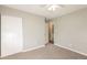 Bedroom with neutral walls and carpet includes closet and access to ensuite bathroom at 1112 Evelyn Drive Dr, Forest Park, GA 30297