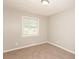 Bedroom with neutral carpet, natural light, and freshly painted walls at 1112 Evelyn Drive Dr, Forest Park, GA 30297
