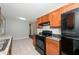 Bright kitchen features stainless steel appliances, granite countertops and wood cabinetry at 1112 Evelyn Drive Dr, Forest Park, GA 30297