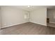 Open-concept living room features new laminate flooring, light gray walls and ample natural light at 1112 Evelyn Drive Dr, Forest Park, GA 30297