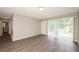 Spacious living room with wood flooring, bright neutral walls, and plenty of natural light at 1112 Evelyn Drive Dr, Forest Park, GA 30297