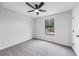Spacious bedroom with a ceiling fan, a window and a door at 2246 Hightrail Ct, Lithonia, GA 30058