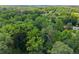 An aerial view of a verdant neighborhood, dotted with homes surrounded by mature trees at 269 Terrydale Se Dr, Marietta, GA 30067