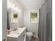 Clean bathroom with a gray shower curtain, neutral color scheme, and sink at 269 Terrydale Se Dr, Marietta, GA 30067