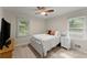 Cozy bedroom with natural light, featuring a ceiling fan and carpet at 269 Terrydale Se Dr, Marietta, GA 30067