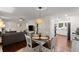 Open-concept dining area with a stylish light fixture, hardwood floors, and a view of the living room at 269 Terrydale Se Dr, Marietta, GA 30067