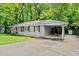 Charming single-story home featuring a classic brick facade, white picket fence, and an inviting carport at 269 Terrydale Se Dr, Marietta, GA 30067