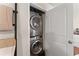 Efficient laundry space features stacked washer and dryer, with adjacent storage at 269 Terrydale Se Dr, Marietta, GA 30067