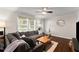 Bright living room with a cozy seating area, hardwood floors, and a view of the dining space at 269 Terrydale Se Dr, Marietta, GA 30067