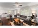 Cozy living room with hardwood floors, a ceiling fan, and large windows providing ample natural light at 269 Terrydale Se Dr, Marietta, GA 30067