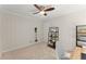 Clean home office space with neutral walls, featuring a ceiling fan and shelving unit at 269 Terrydale Se Dr, Marietta, GA 30067