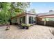 Beautiful brick patio with attached carport and access to the home's living spaces at 2917 Rockingham Nw Dr, Atlanta, GA 30327