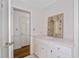 Bright bathroom featuring vanity with ample storage and elegant mirror detail at 2917 Rockingham Nw Dr, Atlanta, GA 30327