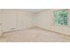 Bright bedroom with closet and large window, offering plenty of natural light at 2917 Rockingham Nw Dr, Atlanta, GA 30327
