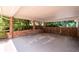 Spacious brick carport provides covered parking and protection from the elements, seamlessly blending with landscaping at 2917 Rockingham Nw Dr, Atlanta, GA 30327