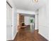 Inviting entryway with hardwood floors and a view of the living room fireplace at 2917 Rockingham Nw Dr, Atlanta, GA 30327