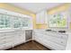 Bright kitchen featuring a bay window, stainless steel dishwasher, and gas range at 2917 Rockingham Nw Dr, Atlanta, GA 30327