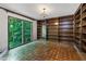 Cozy library with large window and custom built-in bookshelves, ideal for reading and relaxation at 2917 Rockingham Nw Dr, Atlanta, GA 30327