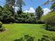 Spacious and vibrant green backyard surrounded by lush trees, providing a private oasis at 3400 Elm Creek Nw Dr, Marietta, GA 30064