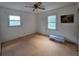 Cozy bedroom featuring two windows and a ceiling fan at 3400 Elm Creek Nw Dr, Marietta, GA 30064