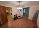 Traditional dining room with wood floors and view into adjacent kitchen area at 3400 Elm Creek Nw Dr, Marietta, GA 30064