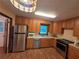 Functional kitchen with stainless steel appliances, ample cabinet space, and a view of the backyard at 3400 Elm Creek Nw Dr, Marietta, GA 30064