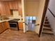 Well-equipped kitchen with modern appliances and direct access to the living area via a staircase at 3400 Elm Creek Nw Dr, Marietta, GA 30064