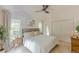 Bright bedroom with a large window, neutral decor, a ceiling fan, and a closet at 4023 Anvil Block Rd, Ellenwood, GA 30294