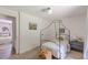 Neutral bedroom with unique black canopy bed frame and adjacent room view at 4023 Anvil Block Rd, Ellenwood, GA 30294