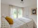 Bedroom featuring natural light, window view, and neutral color scheme at 4023 Anvil Block Rd, Ellenwood, GA 30294