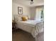 Inviting bedroom with a patterned bedspread, cozy lighting, and a serene ambiance at 4023 Anvil Block Rd, Ellenwood, GA 30294