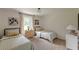 Charming bedroom featuring two beds, natural light, and neutral decor at 4023 Anvil Block Rd, Ellenwood, GA 30294