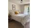 Cozy bedroom with a metal frame bed and an outdoor view from the attached balcony at 4023 Anvil Block Rd, Ellenwood, GA 30294
