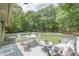 Outdoor deck featuring a dining table and cozy seating area at 4023 Anvil Block Rd, Ellenwood, GA 30294