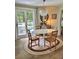 Bright dining area with sliding door, backyard views, and modern decor at 4023 Anvil Block Rd, Ellenwood, GA 30294
