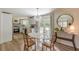 Modern dining area with stylish lighting and a view of the outdoors at 4023 Anvil Block Rd, Ellenwood, GA 30294