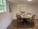 Bright dining room with a round table, comfortable seating, and natural light at 4023 Anvil Block Rd, Ellenwood, GA 30294