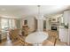 Open-concept dining area adjacent to a well-equipped kitchen at 4023 Anvil Block Rd, Ellenwood, GA 30294