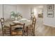 Dining room with a round table, wooden chairs, and an area rug on hardwood floors at 4023 Anvil Block Rd, Ellenwood, GA 30294