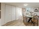 Dining area with an oval table, closet space, and a window for natural light at 4023 Anvil Block Rd, Ellenwood, GA 30294