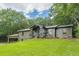 Charming single-story home with a well-manicured lawn and ample curb appeal at 4023 Anvil Block Rd, Ellenwood, GA 30294