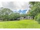 Inviting home exterior with a spacious front yard and carport at 4023 Anvil Block Rd, Ellenwood, GA 30294